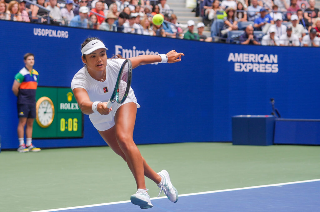 Emma Raducanu lunges to hit a forehand during the US Open 2025 - Mixed Doubles event