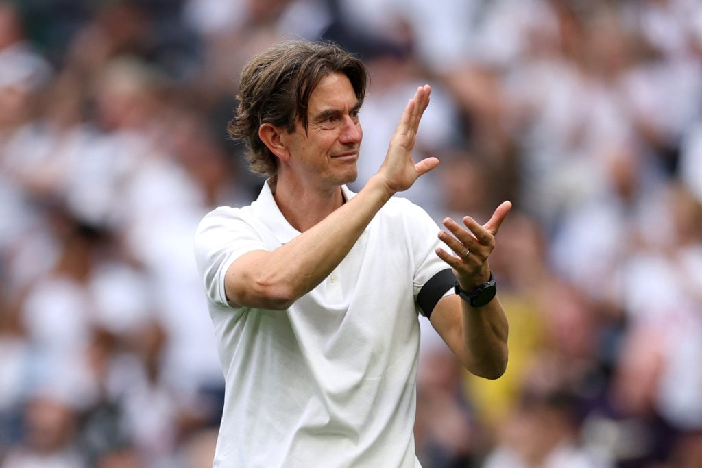 Thomas Frank waves to Tottenham fans during a game