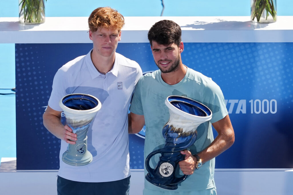 Jannik Sinner of Italy (L) and Carlos Alcaraz of Spain pose for photos with the Rookwood Cups after Sinner retired from the men's singles final match during Day 12 of the Cincinnati Open at the Lindner Family Tennis Center on August 18, 2025 in Mason, Ohio.