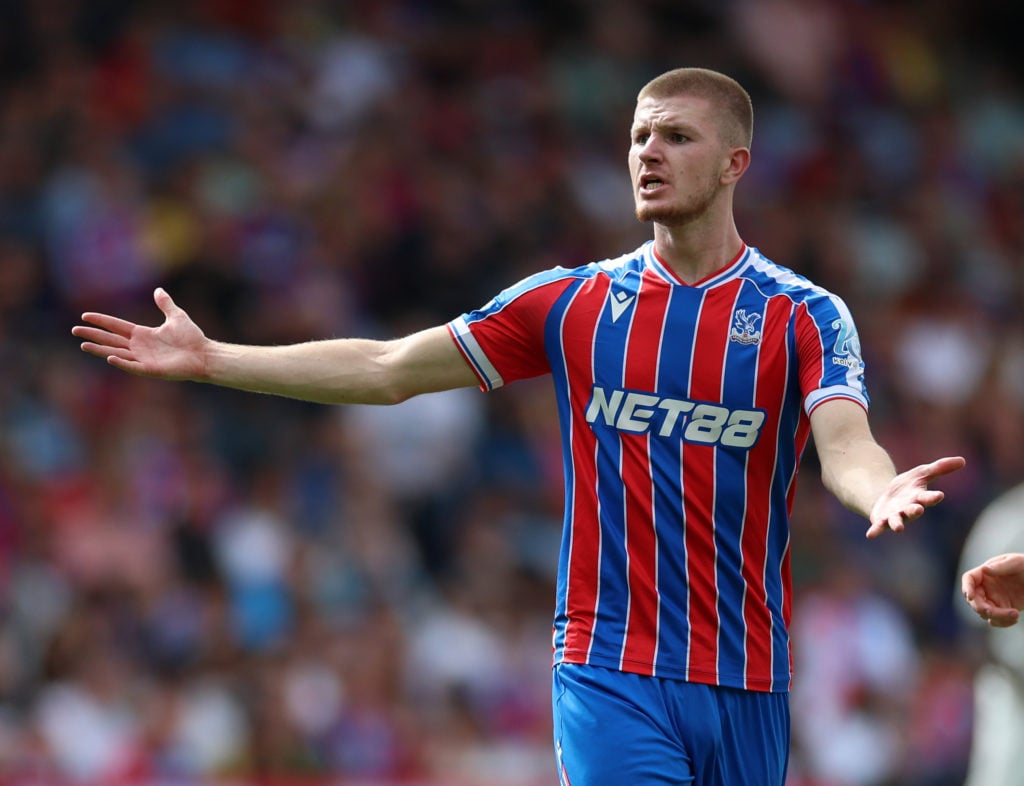 Crystal Palace midfielder Adam Wharton, with both arms out