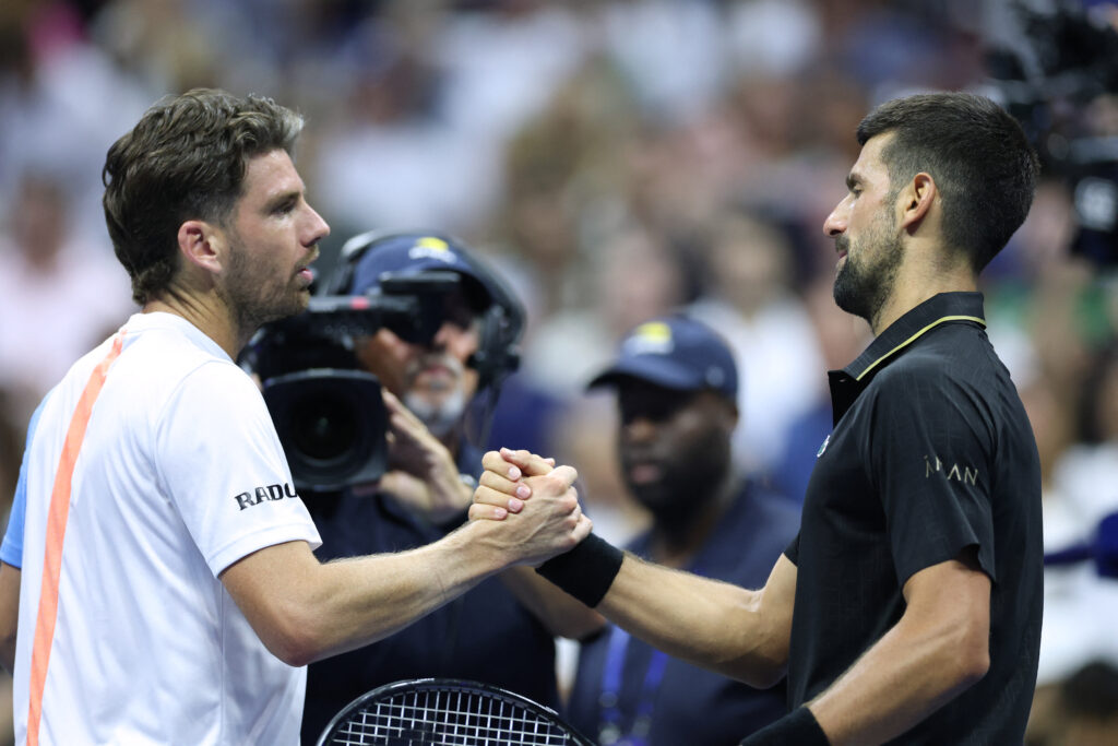 Cameron Norrie and Novak Djokovic shake hands