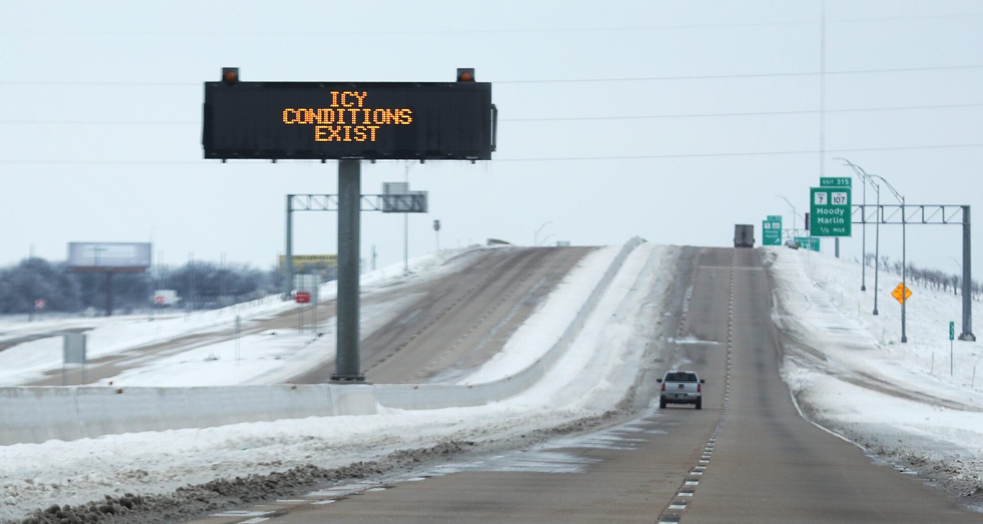 A sign warns of icy conditions on Interstate Highway 35 on February 18, 2021, in Killeen, Texas.