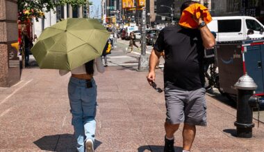 People try to stay cool on the sweltering streets of Manhattan as the region experiences another heatwave on July 29, 2025 in New York City