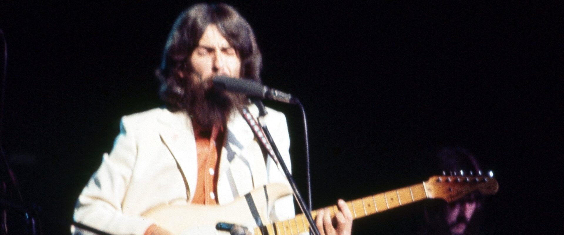 Watch George Harrison’s First Live Performance of His Beatles Classic “Here Comes the Sun,” from The Concert for Bangladesh