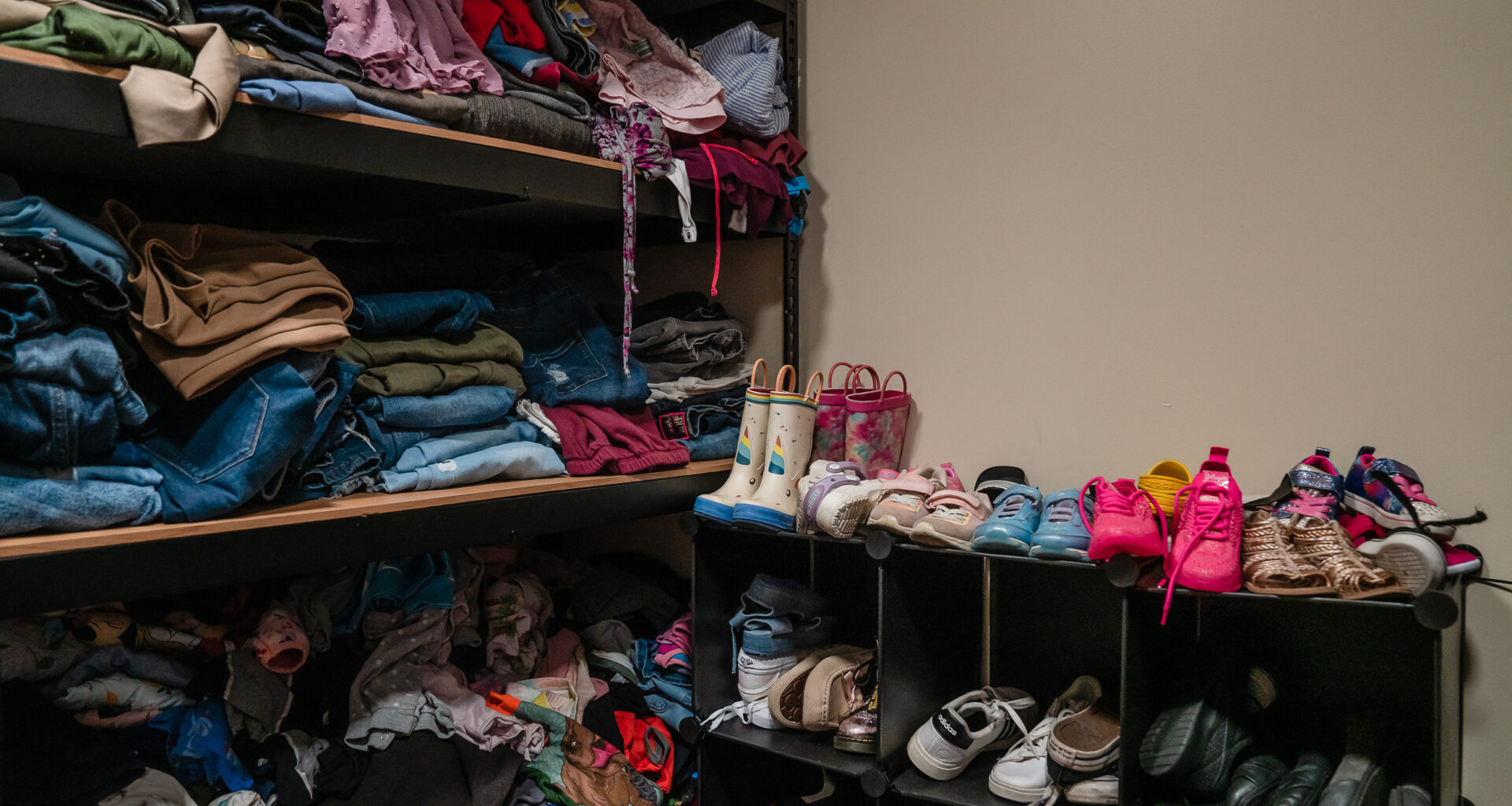 A closet with donated and bought items at Interfaith’s Hawthorne Veteran and Family Resource Center in Escondido on Thursday, Aug. 1, 2024. / Ariana Drehsler for Voice of San Diego