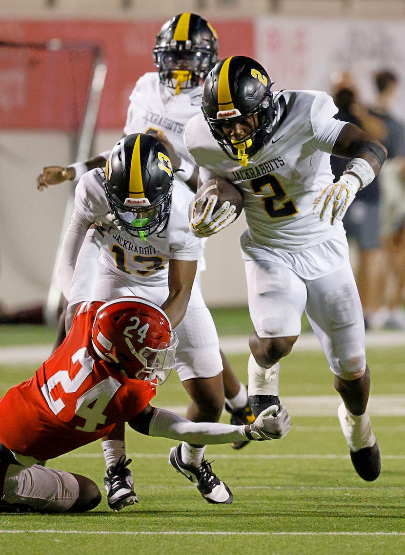 Lake Highlands' Alhossin Bility (24) tries to stop Forney's Javian Osborne (2) in the second...