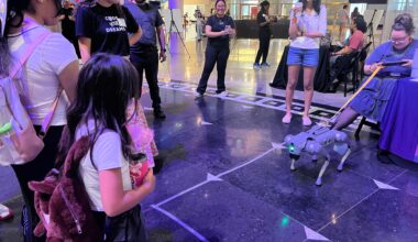 A group watches "Benny" the robot at the Museum of Science and Industry