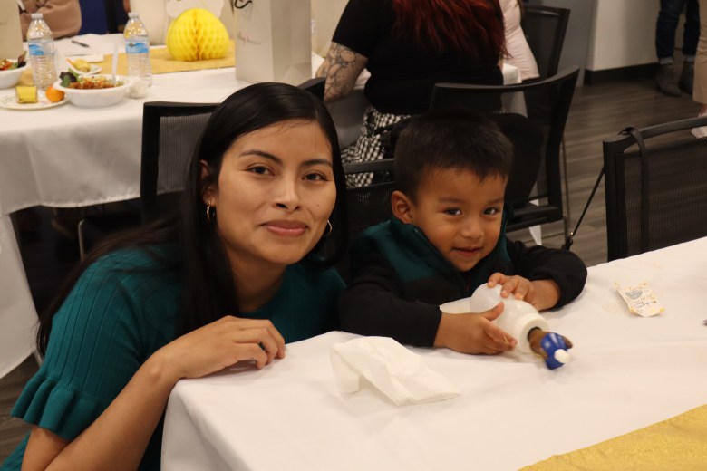 Stephanie Juarez attends a baby shower with her young son.