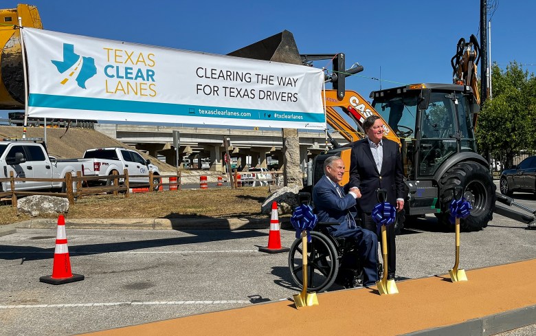 Gov. Greg Abbott and J. Bruce Bugg Jr., chairman of the Texas Transportation Commission, pose for a photo Wednesday during a groundbreaking ceremony to mark the start of work on the second segment of the Loop 1604 expansion project.