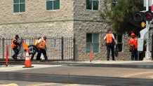 Investigators appear to haul away pieces of an electric bicycle after a deadly crash in Chula Vista on Monday Aug. 4, 2025. 