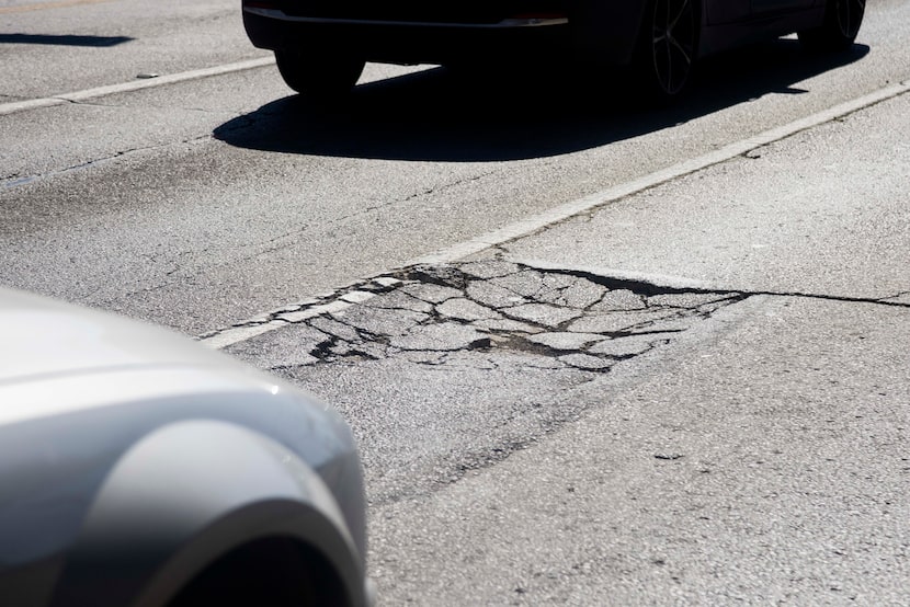 A pothole on Ross Avenue photographed on Feb. 21, 2024, in Dallas.