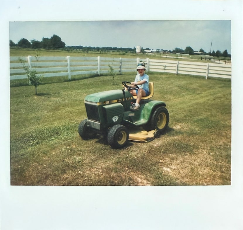 Tomboy Monica Paul on her grandfather's tractor at the family's farm in Caldwell, Texas. 