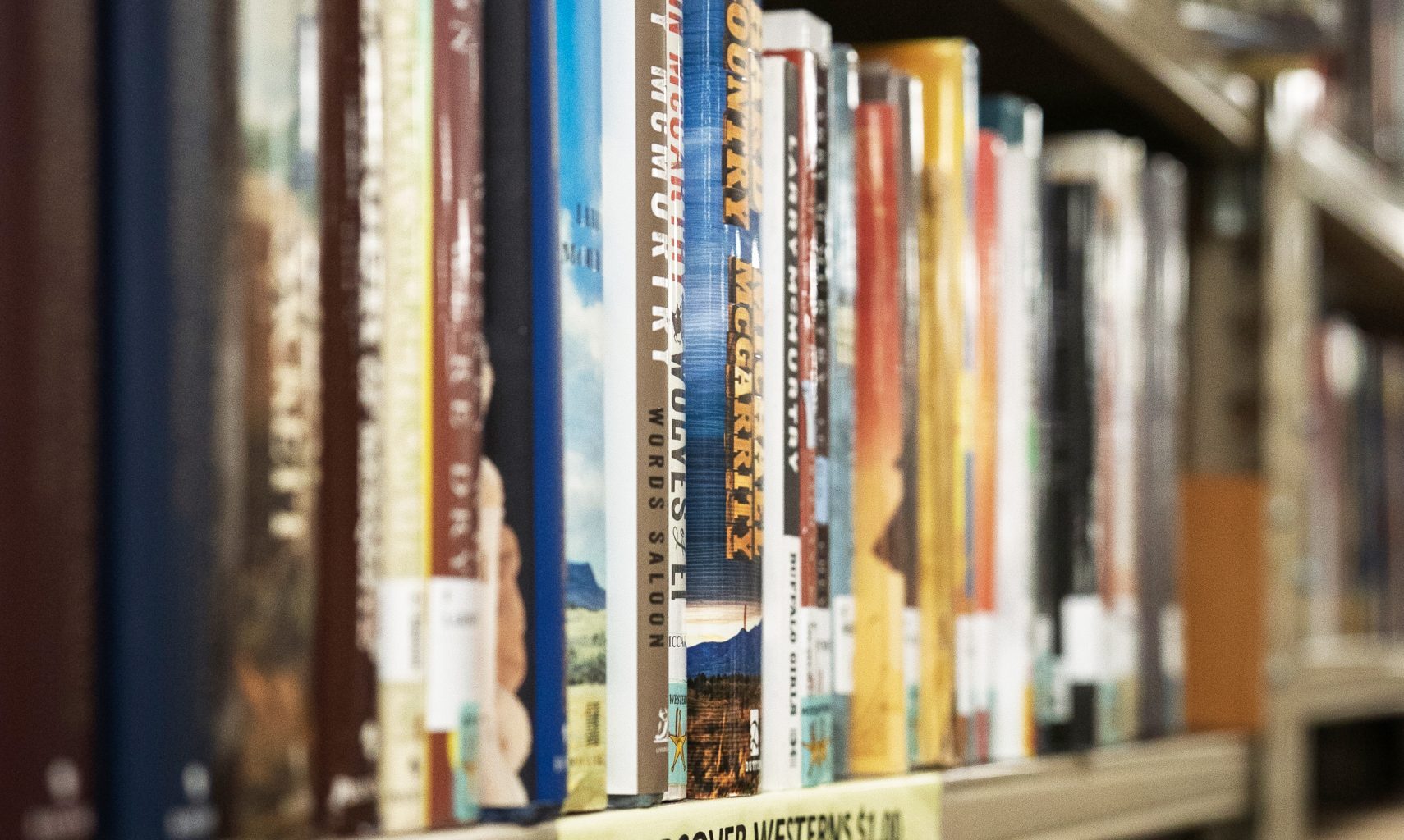A close-up photo shows the Western books on display at one of Fayetteville's public libraries.