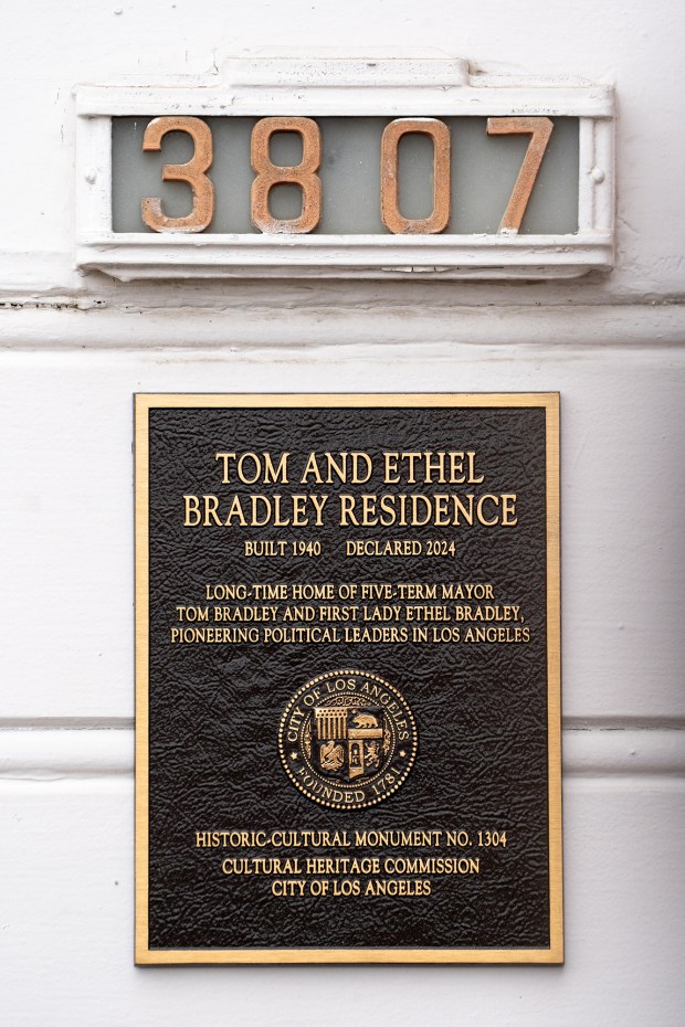 A plaque honoring the former residence of Tom and Ethel...