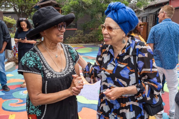Jacqueline Sykes, chief administrator of St. Elmo Village, left, and...