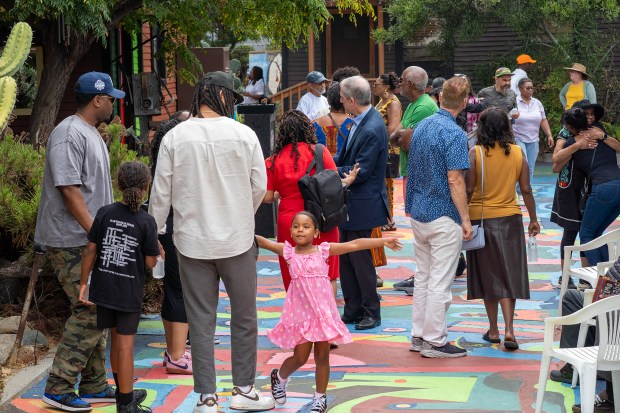 Guests mingle following the plaque unveiling ceremony at St. Elmo...