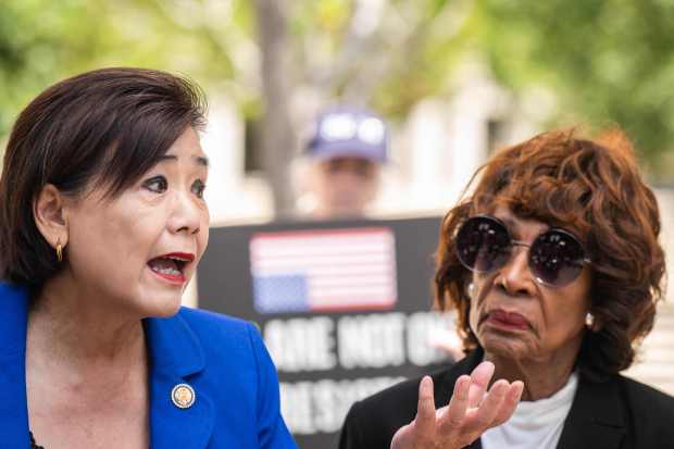 Reps. Judy Chu and Maxine Waters speak to the press...