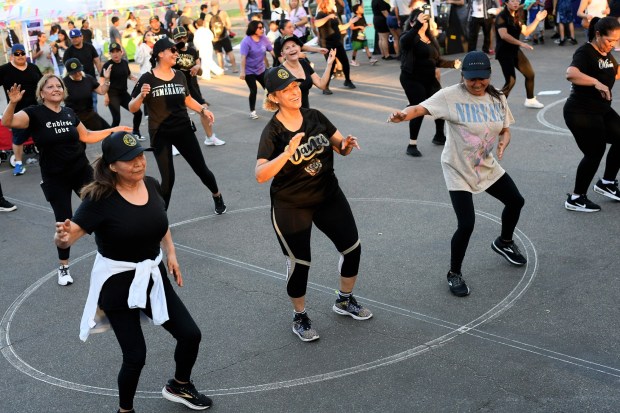Dancers enjoy a Zumba class during the PLAyLA community celebration at North Hollywood's Valley Plaza Recreation Center July 31, 2025. Councilmember Adrin Nazarian and the Dept. of Recreation and Parks hosted the free event which provided over 400 free backpacks and a free meal to those in attendance.(Photo by Andy Holzman, Contributing Photographer)