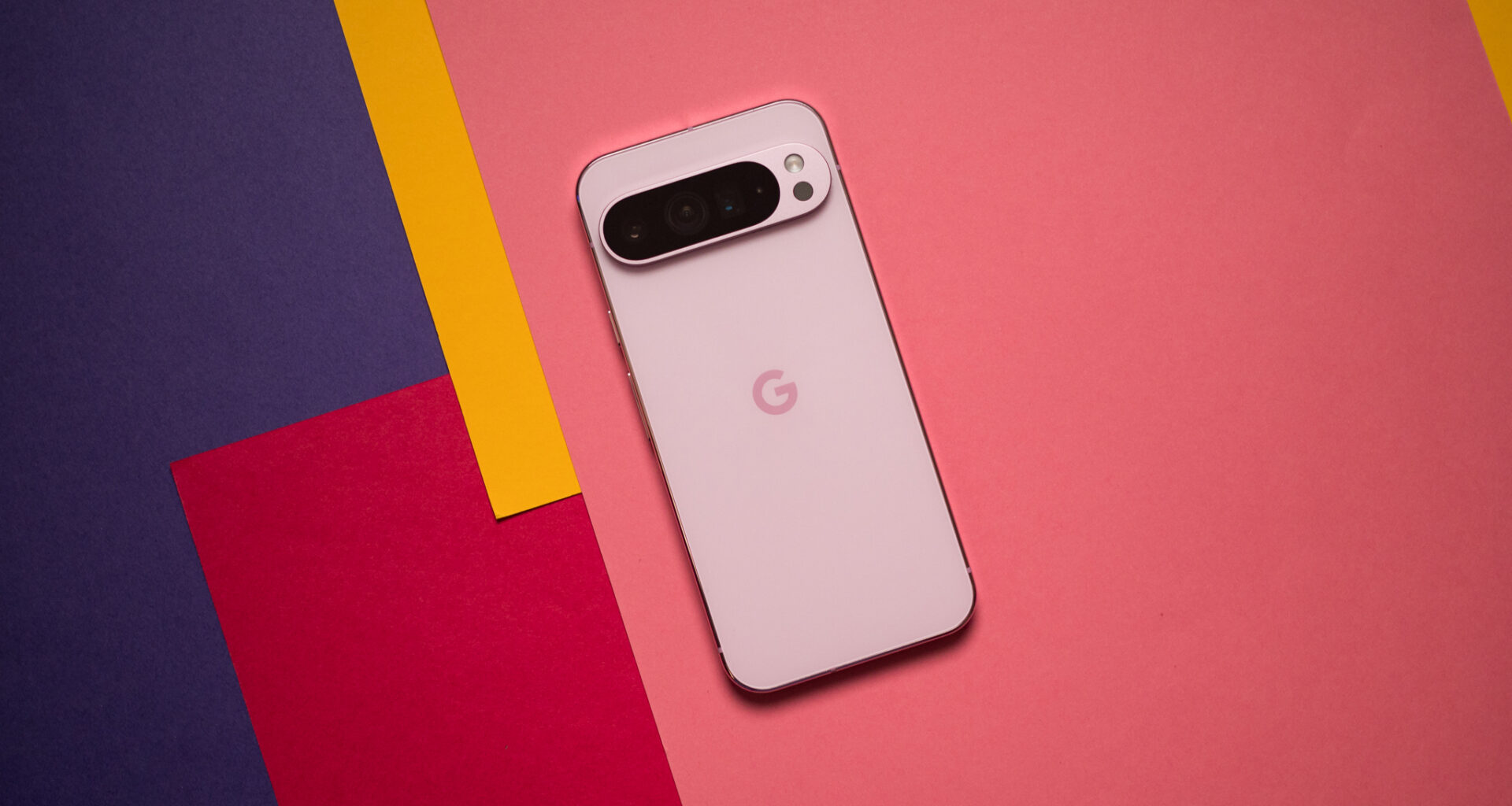 Pixel 9 Pro XL back view against colorful background