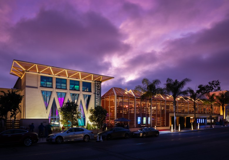 The exterior of The Conrad at night