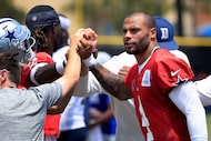 Dallas Cowboys Dak Prescott (4) and the rest of the quarterbacks break a huddle to end...