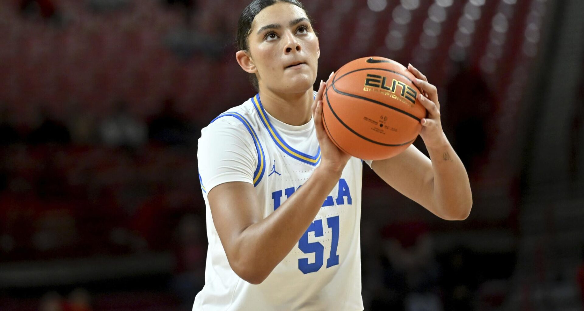 UCLA Star Lauren Betts Serves Up BTS Magic in Striking Pink Crop Tee and Black Under Armour Fit