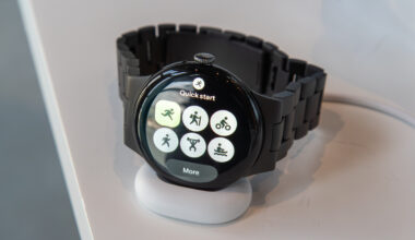 Pixel Watch 4 on the charger showing the Fitbit Quick Start Tile