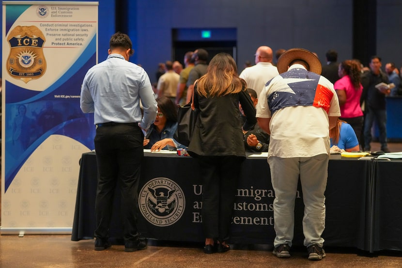 People are checked in during an ICE hiring fair Tuesday, Aug. 26, 2025, in Arlington. 