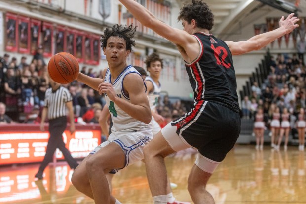 Jase Butler (4) of Branson attempts to get around the...