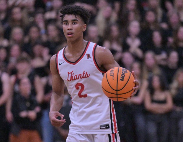 Semetri Carr of Redwood heads down the court during their...