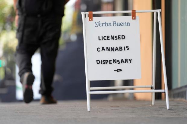 A sign is displayed outside of Yerba Buena in the Brooklyn borough of New York, Tuesday, Aug. 12, 2025. (AP Photo/Seth Wenig)