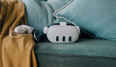 The Meta Quest 3 headset rests on a green couch alongside a controller.