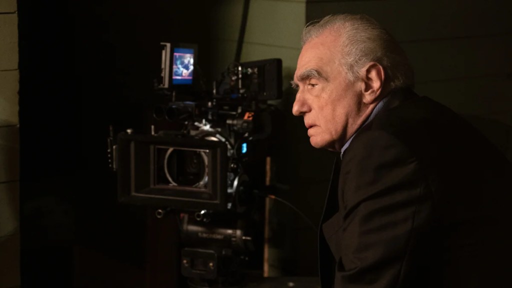 Martin Scorsese looks into a film camera