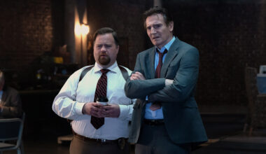 Paul Walter Hauser plays Ed Hocken Jr. and Liam Neeson plays Frank Drebin Jr. in The Naked Gun from Paramount Pictures.