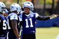 Dallas Cowboys defensive end Micah Parsons (11) gives instruction to rookie defensive end...