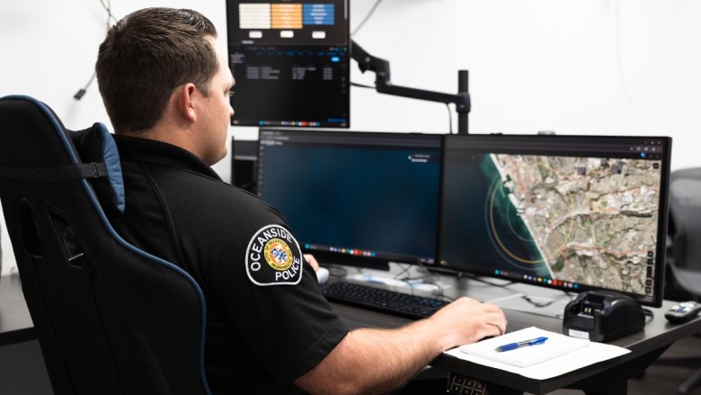 police officer at a computer screen