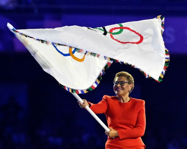 Los Angeles Mayor Karen Bass receives the Olympic flag during...