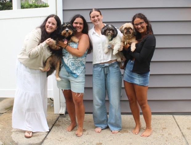 Em, Grace, Faith, and Hannah Scally had their doggie friends...
