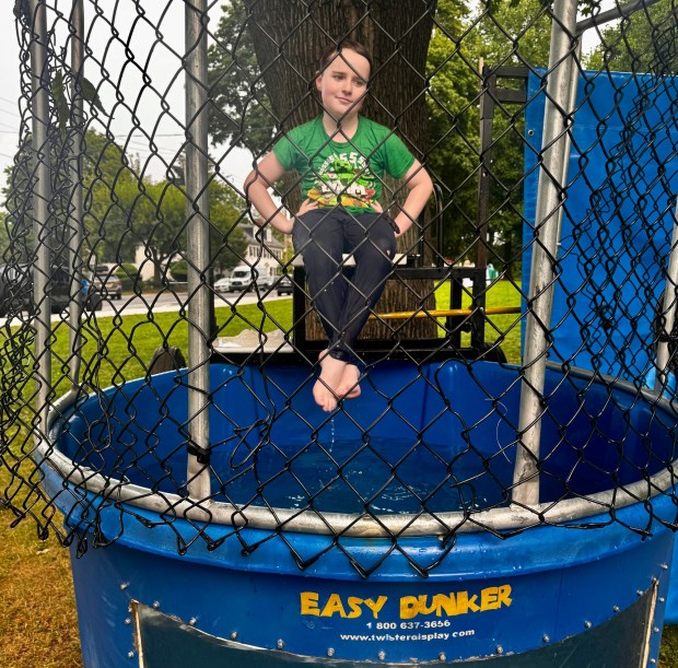 Courageous Linus Nannery enthusiastically climbed back up on the dunk tank seat despite countless dunkings. (Photo by Rick Cawley)