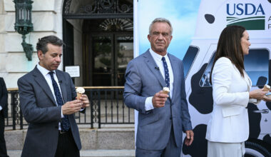 (L/R) Food and Drug Administration Commissioner (FDA) Martin Makary, Secretary of Health and Human Services Robert F. Kennedy Jr., and Secretary of Agriculture Brooke Rollins eat ice cream at the end of a news conference at the USDA headquarters building in Washington, DC. (Brendan SMIALOWSKI / AFP via Getty)