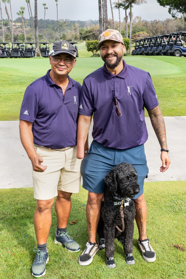 Lou Chan, Jacob Williams, Sasha the dog (Jon Clark)
