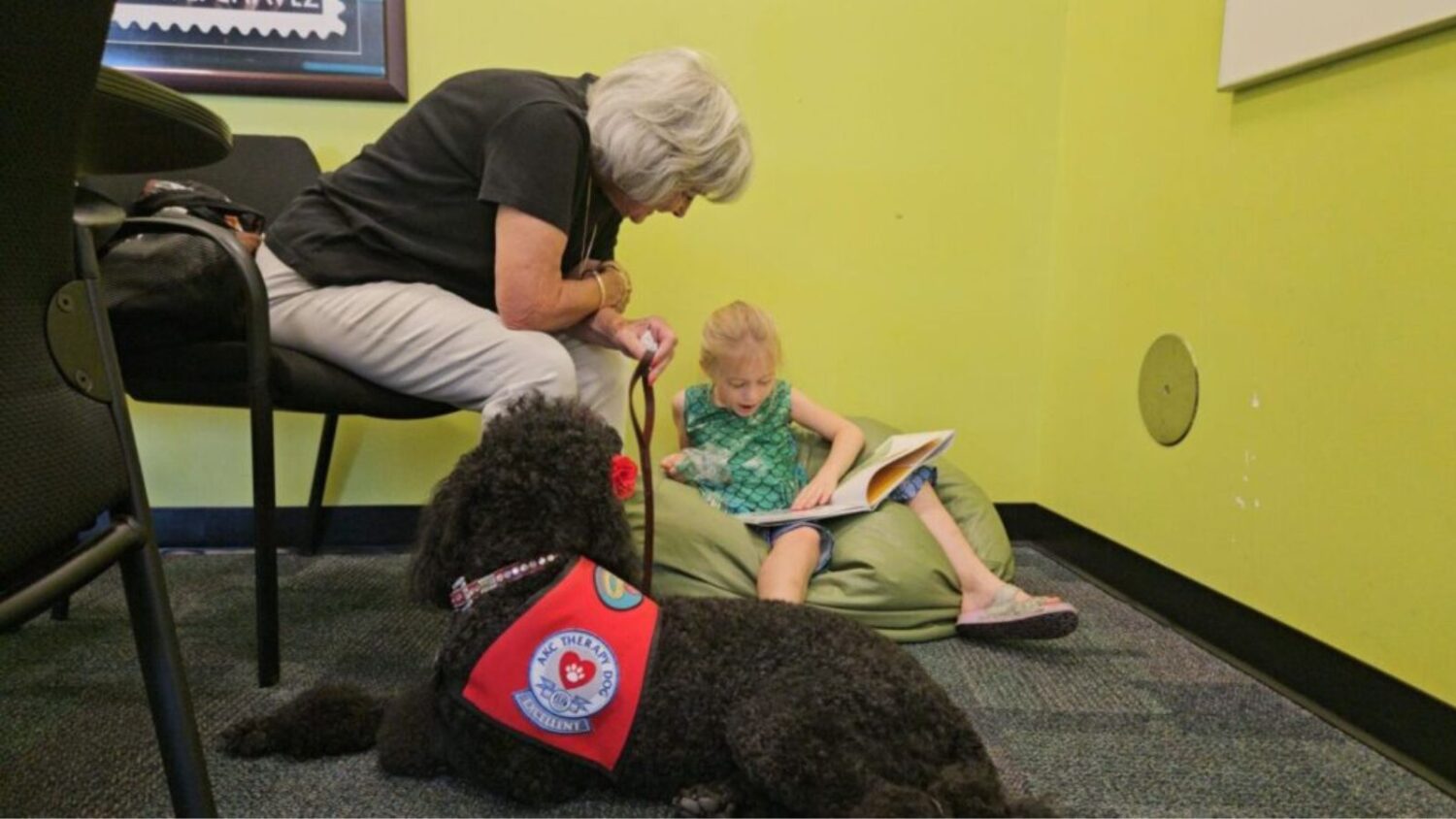 Kids can read to dogs to build literacy skills in Phoenix...