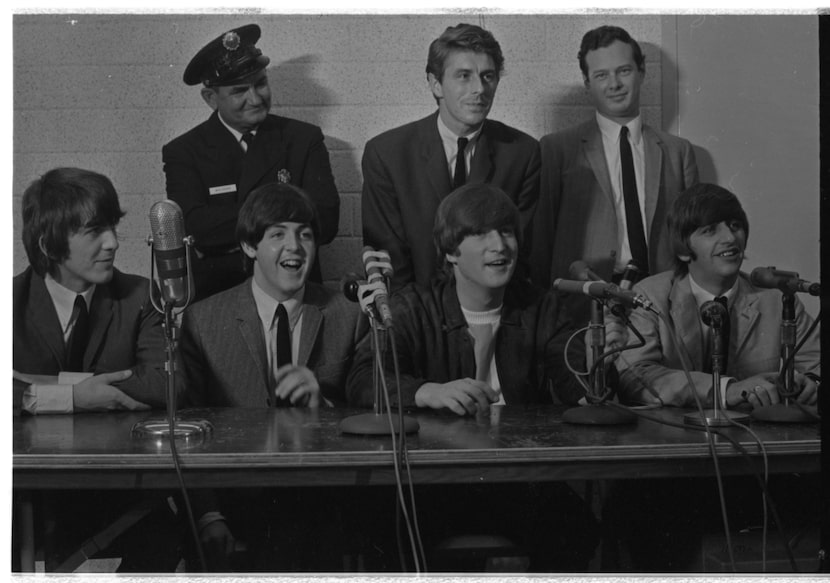 The Beatles and, at top right, manager Brian Epstein spoke to Dallas media before their...