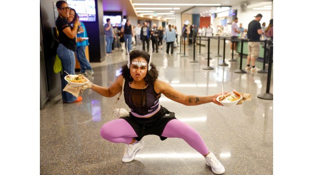 Naomi Johnson, of Oakland, shows off her team spirit as she takes on the role of a true Valkyries fan after grabbing some food during the Golden State Valkyries game against The Las Vegas Aces at the Chase Center in San Francisco on Aug. 6, 2025. (Shae Hammond/Bay Area News Group)