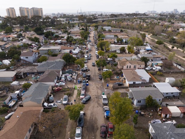 On Wednesday, January 24, 2024, residents of Beta Street begin the cleanup after their homes flooded two days earlier. (Nelvin C. Cepeda / The San Diego Union-Tribune)