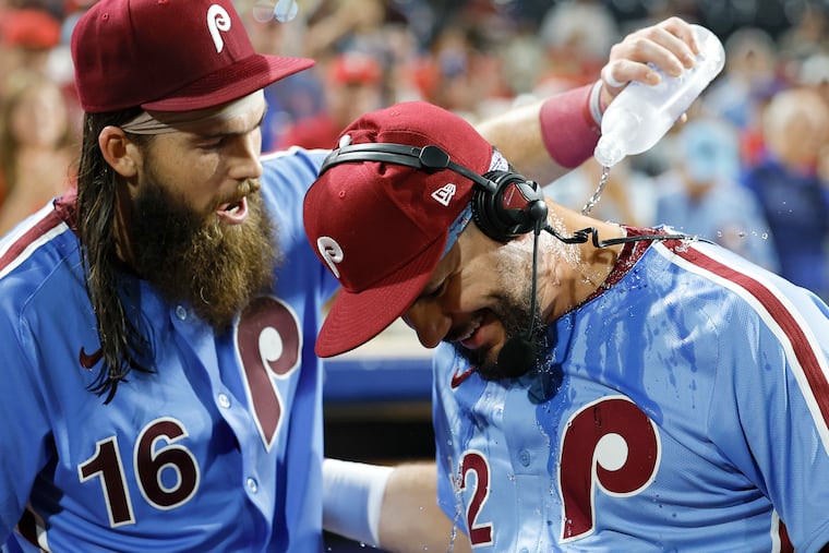 Brandon Marsh pours water over Phillies slugger Kyle Schwarber following his historic four-homer night Thursday against the Atlanta Braves.