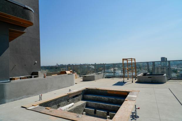 A hot tub and pool area under construction on the...