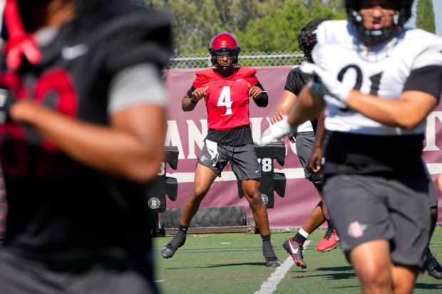 Aztecs Jayden Denegal runs through stretching drills at the start of the first day of team practice at San Diego State University on Wednesday, July 30, 2025, in San Diego, CA.  (Nelvin C. Cepeda / The San Diego Union-Tribune)