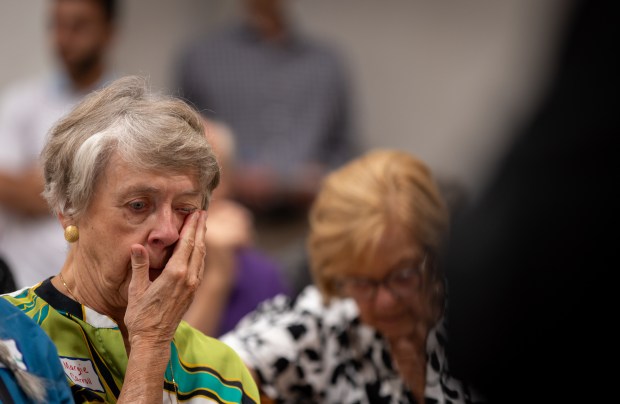 Margie Carroll, a volunteer, becomes emotional while learning about a pilot program called Faithful Accompaniment in Trust & Hope at the San Diego Pastoral Center on Monday, Aug. 4, 2025 in San Diego, California. The interfaith program will have volunteers join refugees and asylum seekers during court hearings. (Ana Ramirez / The San Diego Union-Tribune)