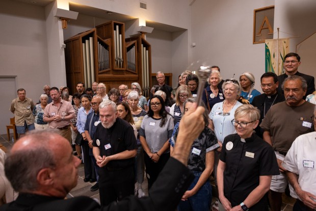 Auxiliary Bishop of San Diego Ramon Bejarano blesses a crowd at the San Diego Pastoral Center on Monday, Aug. 4, 2025 in San Diego, California. (Ana Ramirez / The San Diego Union-Tribune)